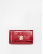 Dune Embossed Snake Clutch Bag - Lyst