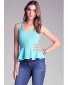 Bebe Peplum Logo Tank Top - Lyst