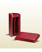 Gucci G Script Charm Zip Around Wallet - Lyst