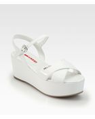 Prada Patent Leather Crisscross Wedge Sandals - Lyst