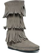 Minnetonka Three Layer Fringe Boots - Lyst