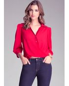Bebe Twist Hem Silk Blouse - Lyst