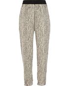 River Island Cream Print Soft Tapered Trousers - Lyst