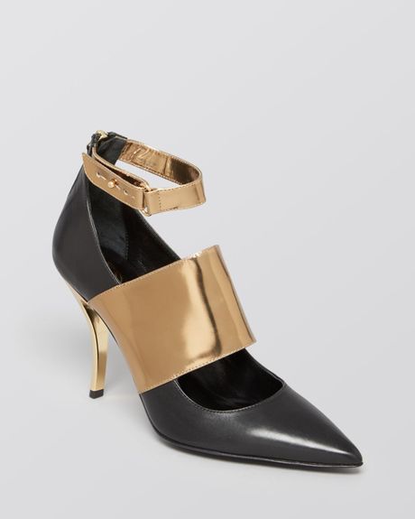pointed toe gold pumps