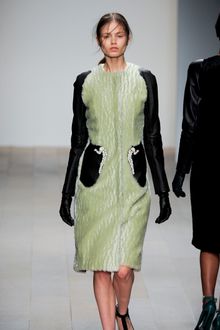 Marios Schwab Fall 2012 Long Sleeve Collar-Less Fur Coat With Contrasting Sleeves And Stone Encrusted Pocket Details  In Pale Green And Black  - Lyst