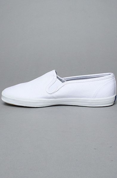 white canvas slip on keds