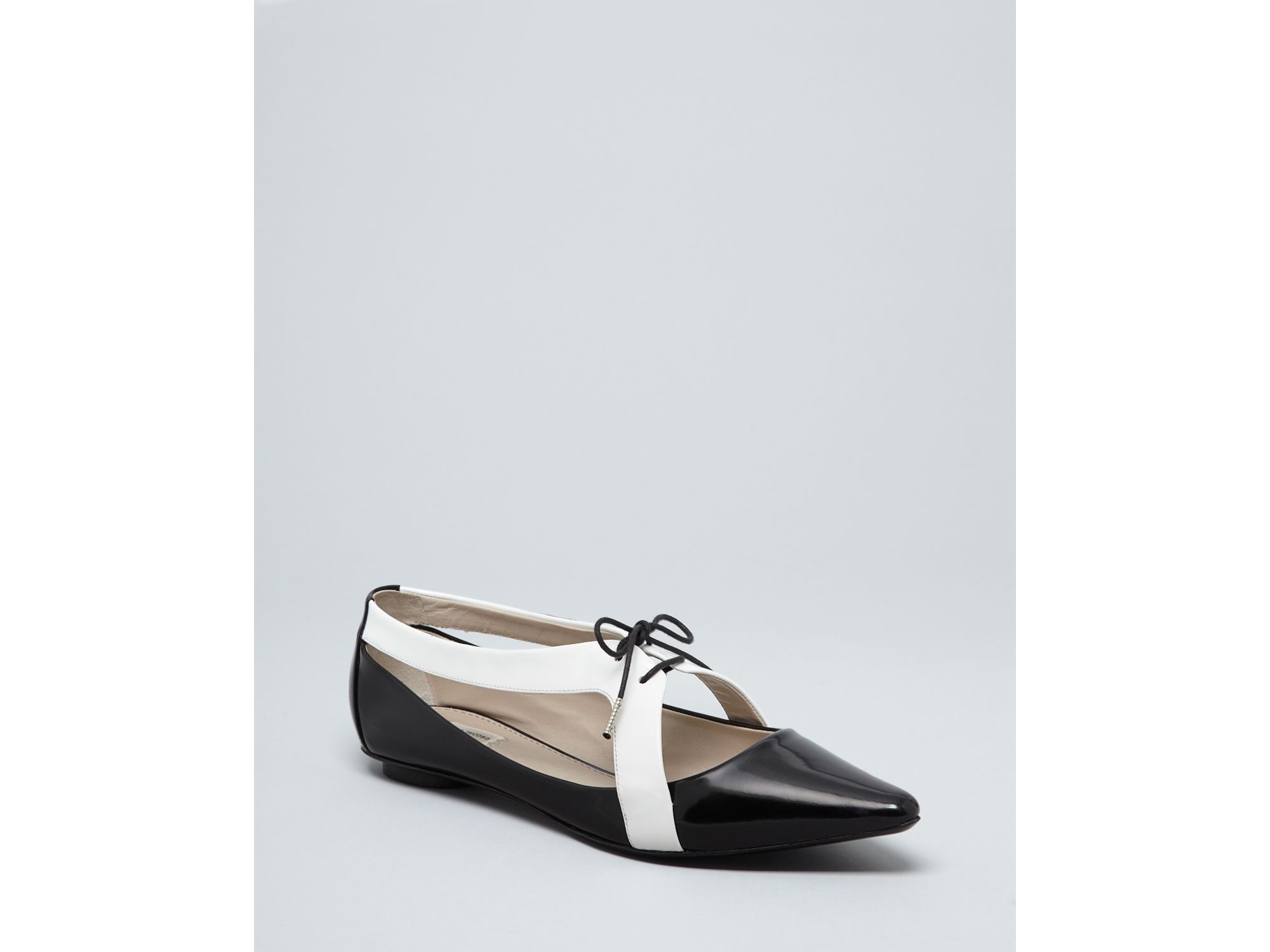 black pointed toe lace up flats