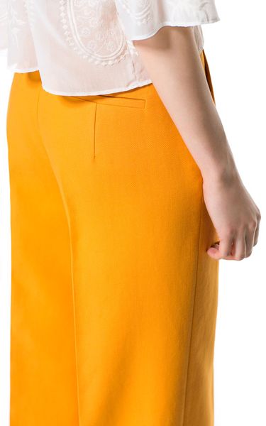 orange trousers zara