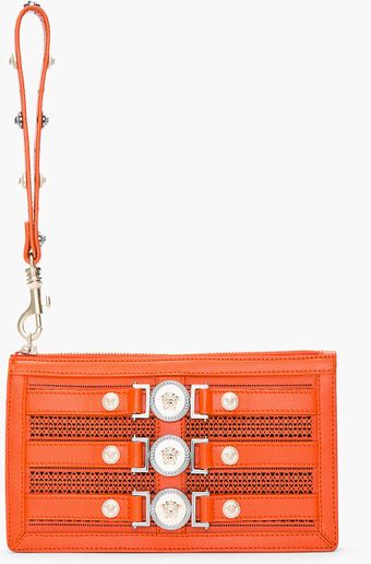 Versace Orange Leather Medallion Cutout Wristlet Clutch - Lyst