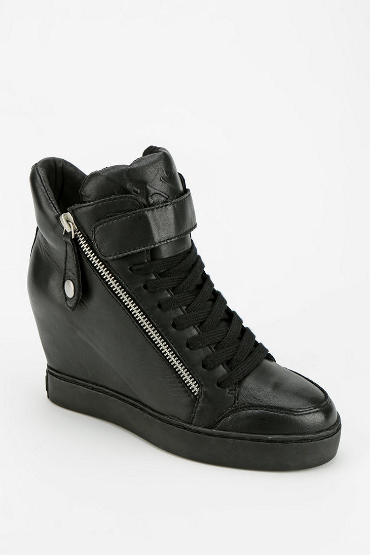 black hidden wedge trainers