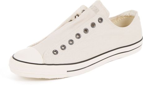 white slip on converse