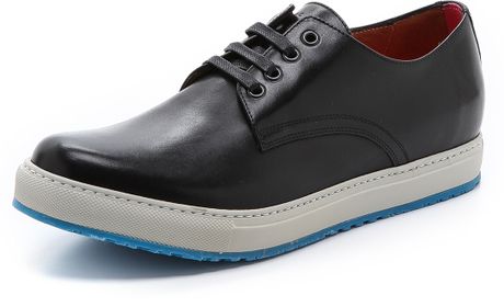 black leather sneaker with white sole