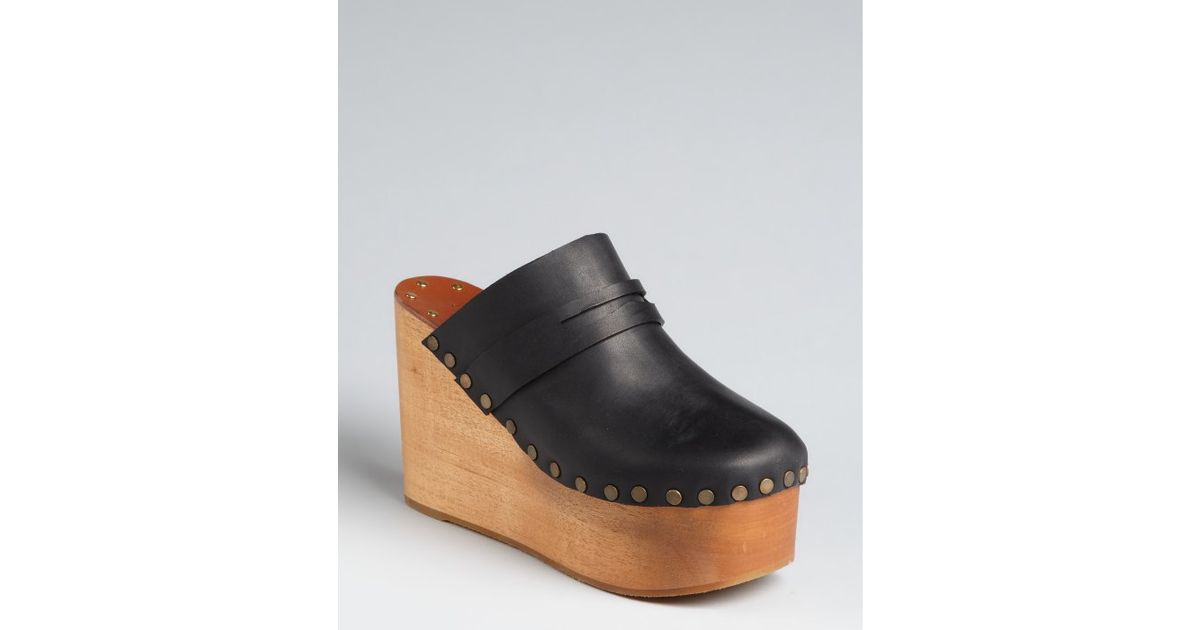 leather clogs with wooden heels