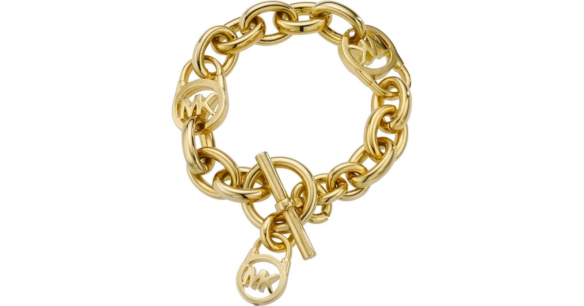 Lyst Michael Kors Logo Lock Charm Bracelet In Metallic