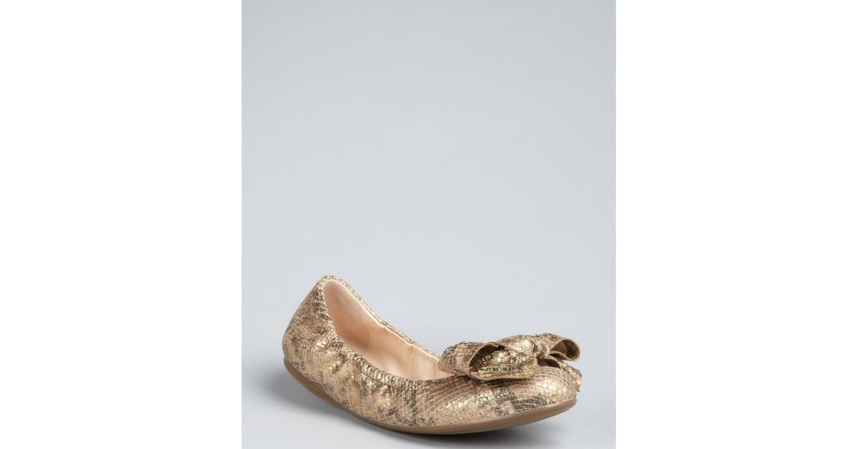 gold prada flats