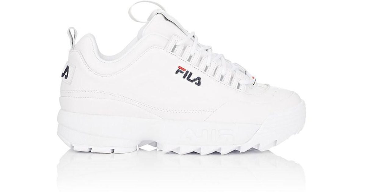 white disruptor sneakers