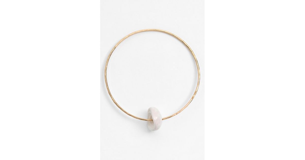Lyst Ki Ele Puka Shell Bangle In Metallic