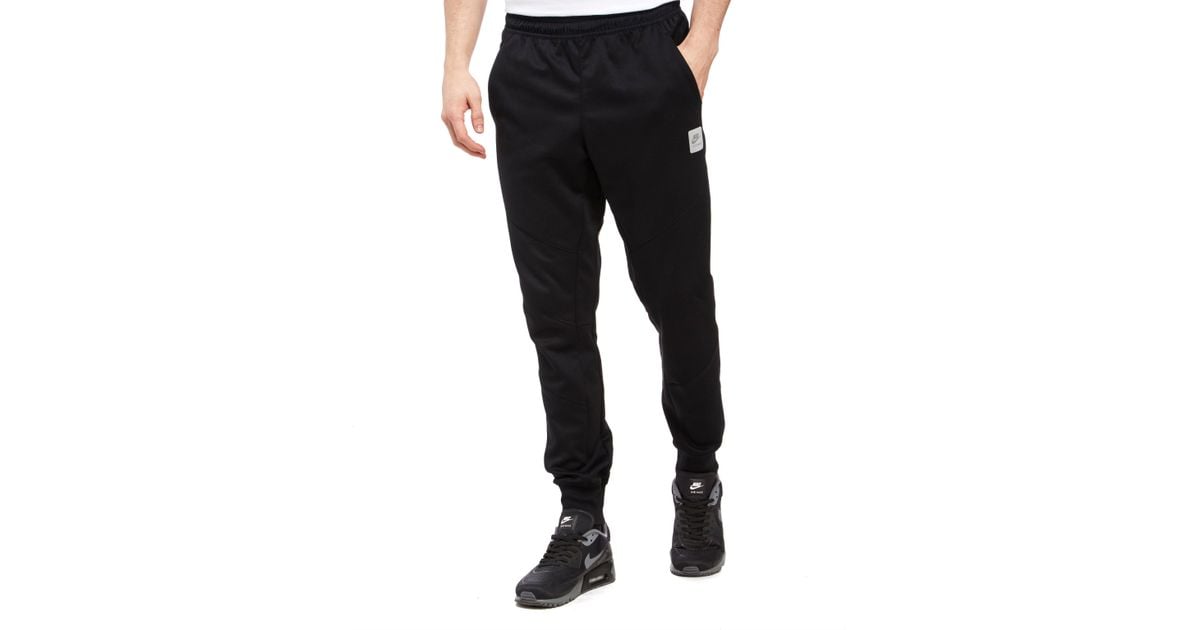 nike poly tape track pants