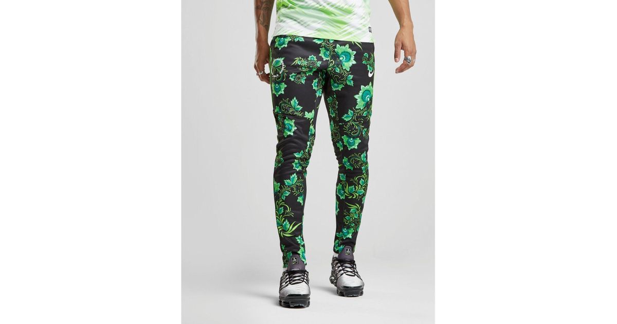 nike tribute joggers in green