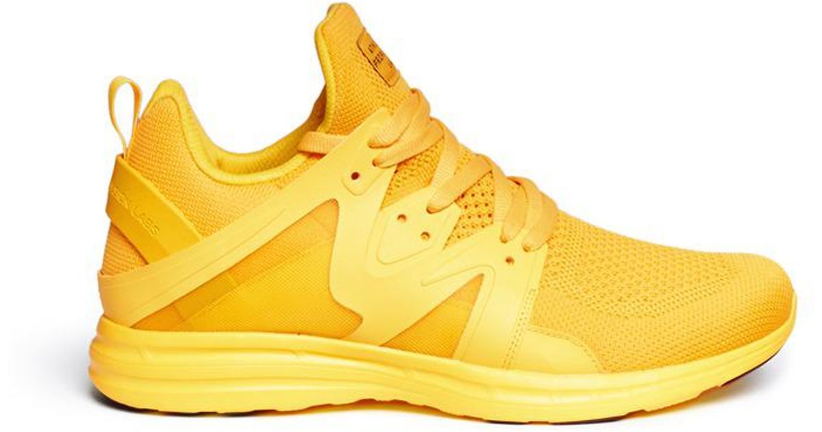 black and yellow mens tennis shoes