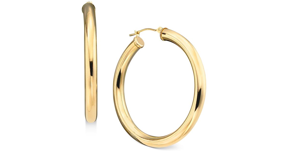 Lyst Macy'S 14k Gold Large Polished Hoop Earrings in Metallic