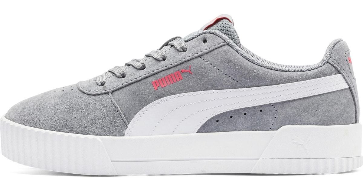 white puma carina sneakers
