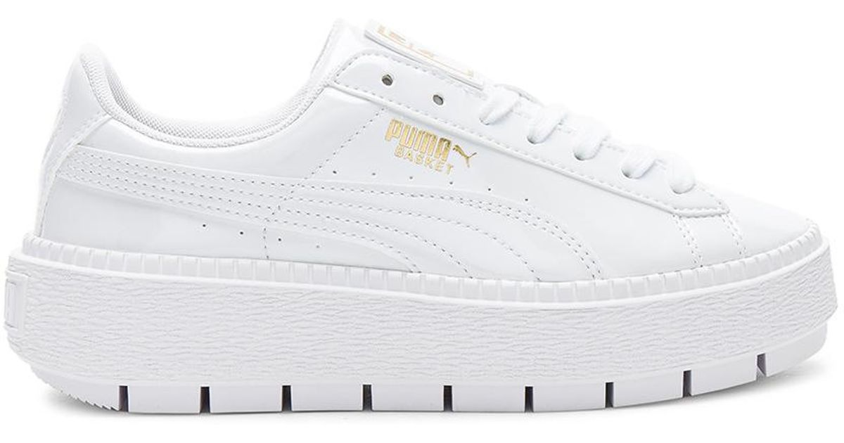 white puma platform trainers