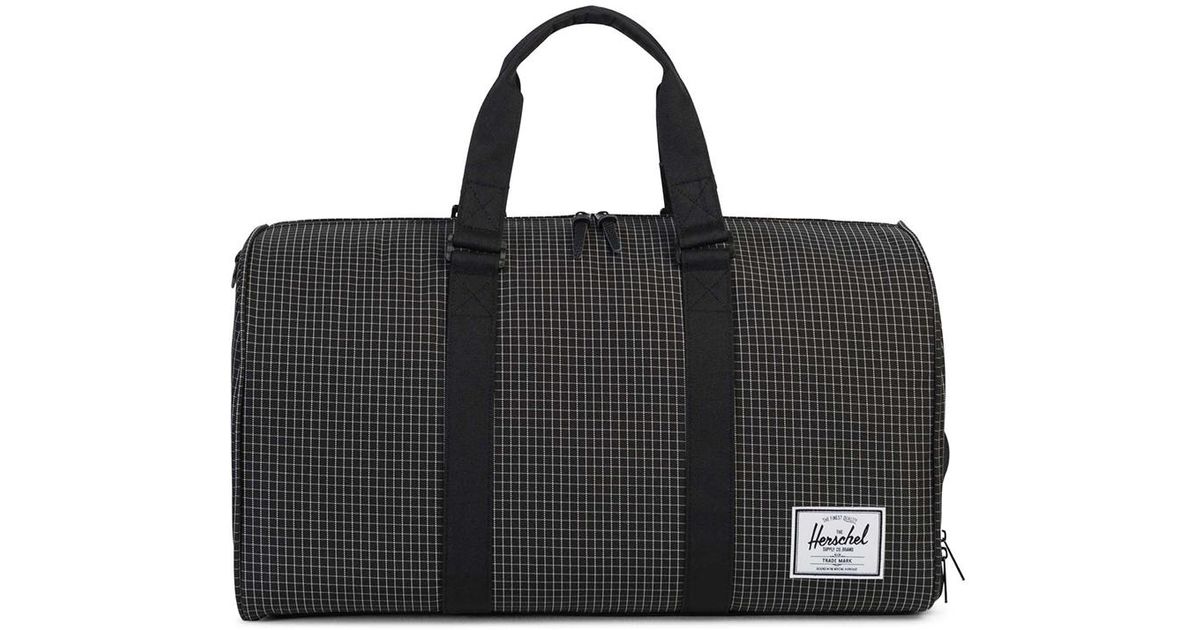 Lyst Herschel Supply Co Novel Duffle Bag Grid Black In For Men