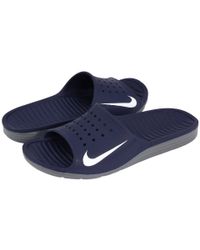 dark blue nike slides