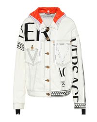 Veste en jean à logo et capuche Versace en coloris White