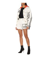 Veste en jean à logo et capuche Versace en coloris White