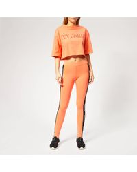 Ivy Park Orange V Active Logo Elastic Tape Tights
