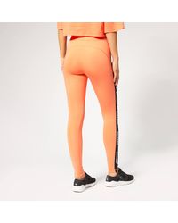 Ivy Park Orange V Active Logo Elastic Tape Tights