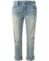 créditos foto: https://cdnb.lystit.com/200/250/tr/photos/0c4b-2015/11/02/juicy-couture-embellished-boyfriend-jeans-product-0-684433825-normal.jpeg