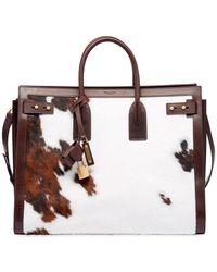 Lyst Louis Vuitton Cabas Naxos M95887 Men S Leather Tote Bag In White Saint Laurent Men S Ysl Tote Bag In Cow Print Lyst