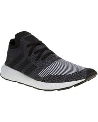 lyst adidas swift run primeknit formatori in nero per gli uomini. lyst adidas swift run primeknit formatori in nero per gli uomini.