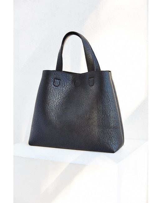 Urban outfitters Mini Reversible Vegan Leather Tote Bag in Black | Lyst