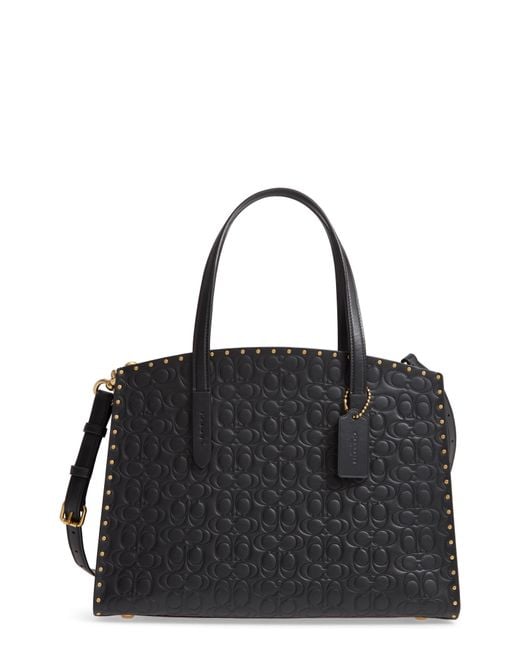 COACH Logo Embossed Studded Leather Tote in Black Lyst