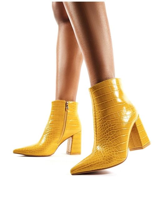 mustard colored shoes and boots
