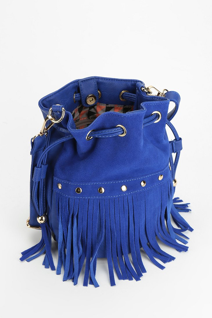 Lyst Urban Outfitters Cruz Studded Suede Fringe Bucket Bag in Blue