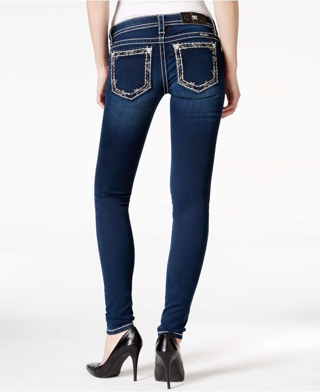 dark blue jeans with white stitching