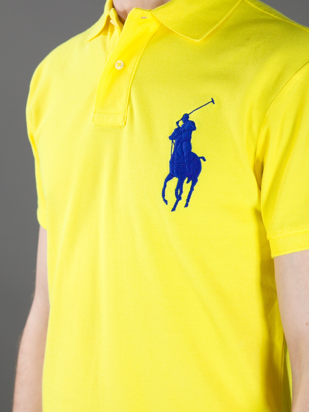 yellow polo shirt with blue horse