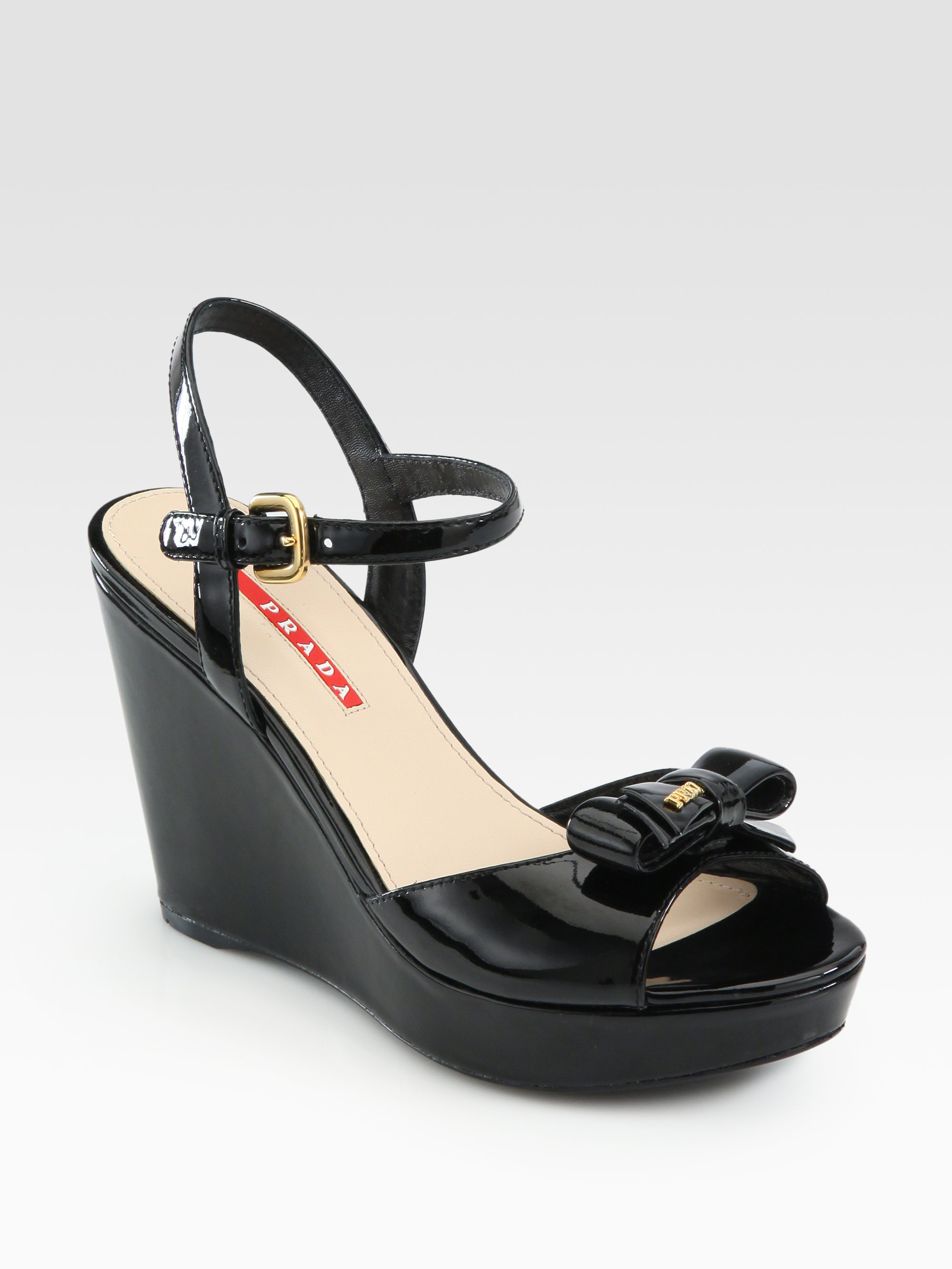 Prada Patent Leather Bow Wedge Sandals in Black | Lyst