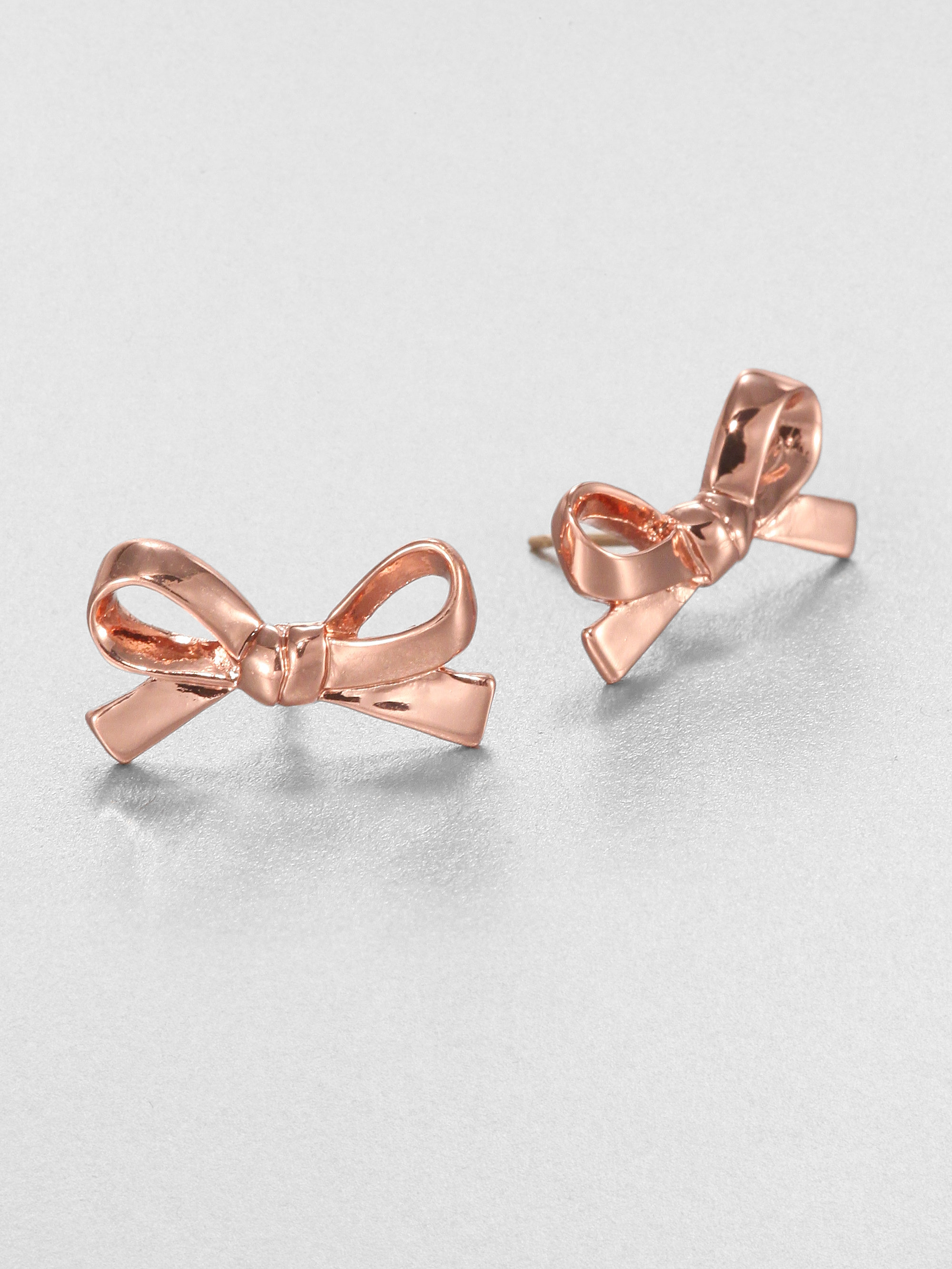 Lyst Kate Spade New York Skinny Mini Bow Earrings In Metallic Gallery