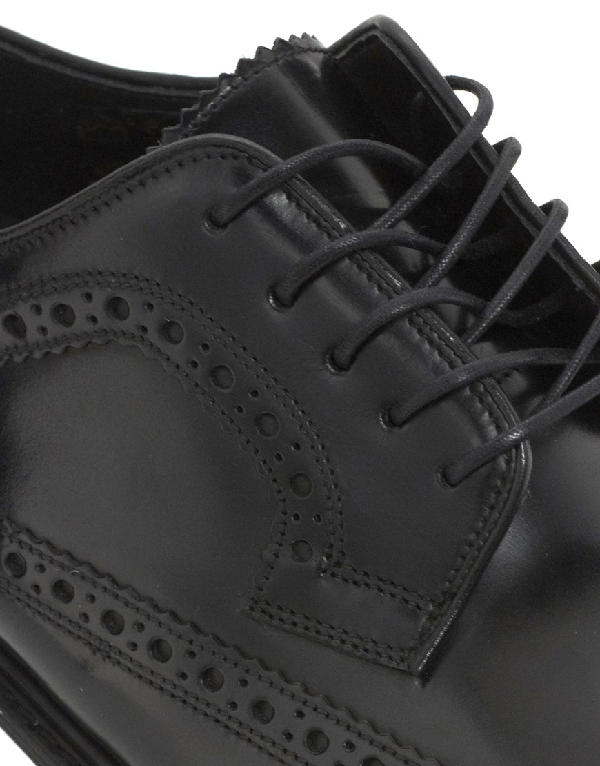 black brogues with brown soles