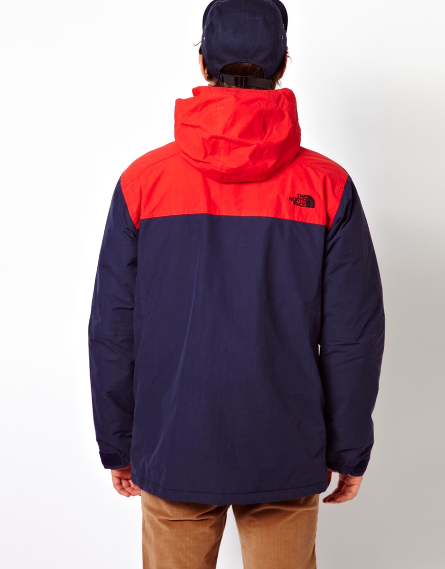 red and blue north face jacket