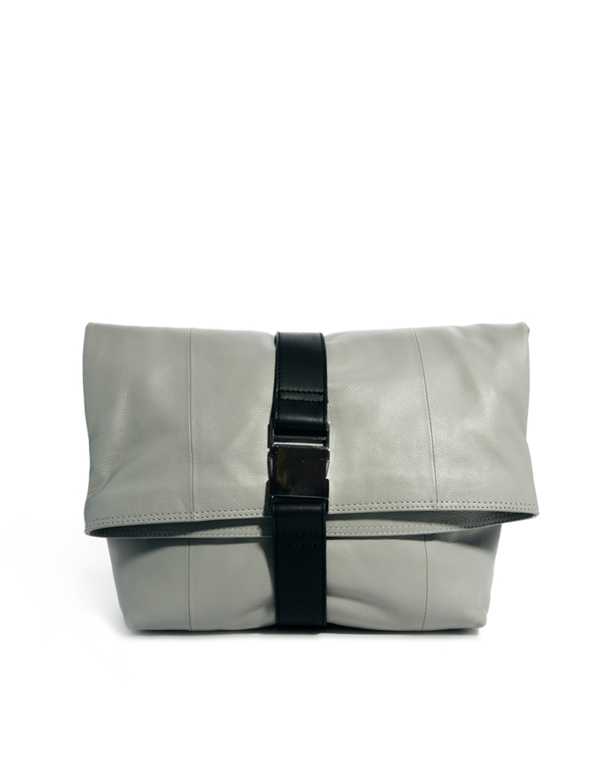 grey and white clutch bag