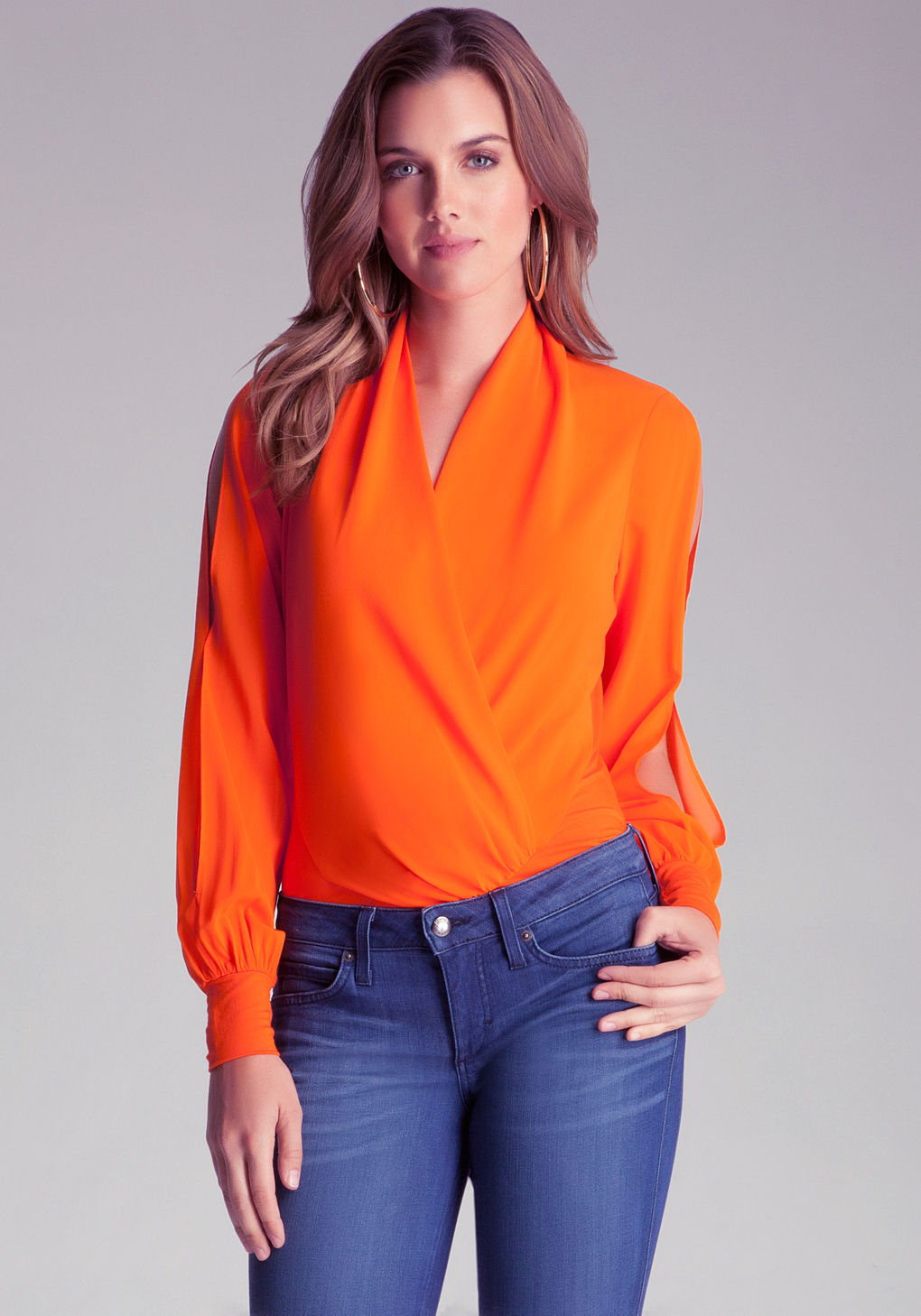 Bebe Long Sleeve Wrap Bodysuit in Orange Lyst