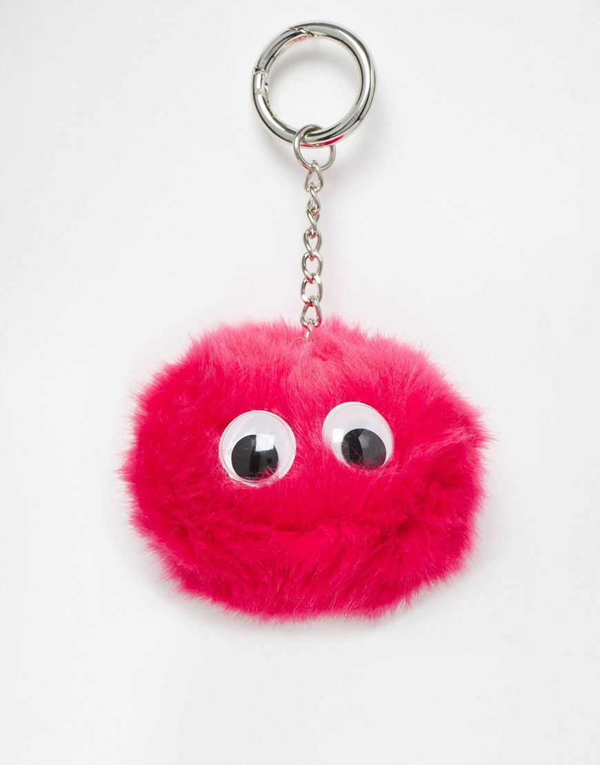 Lyst Asos Large Fluff Ball Keychain With Googly Eyes in Pink