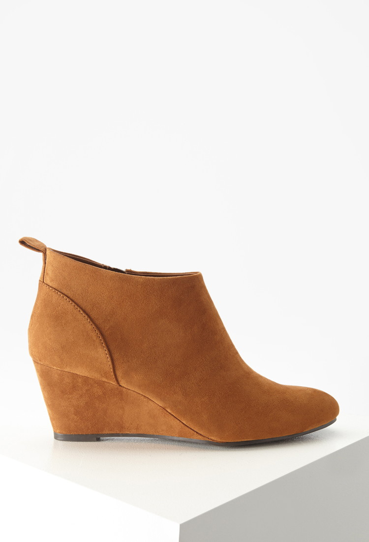 Sign Up to Get a FREE Lipgloss! A split shaft with on-trend perforations and whipstitch trim freshens a Western-inspired leather bootie grounded by a low stacked heel. M=standard cripatsur.ga: $